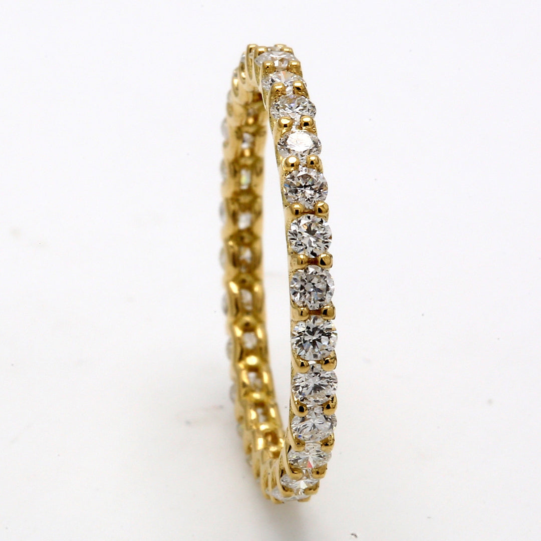 Eternity band in 14K YG with U-prong set (28) round diamonds.  D0.83ct.t.w.  Size 5.75