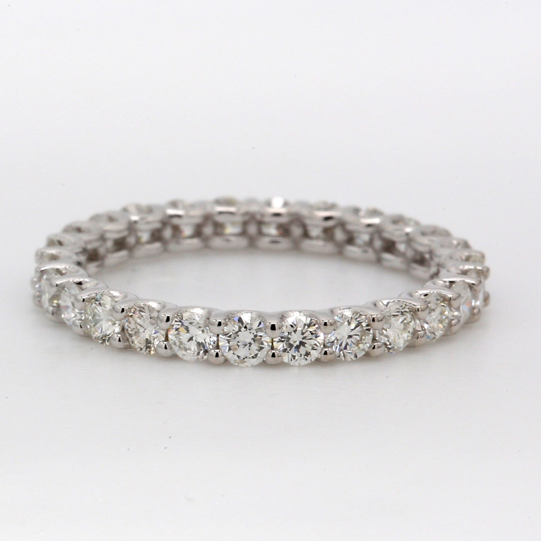 Eternity band in 18K WG with U-prong set (26) round diamonds.  D1.15ct.t.w.  Size 5.25