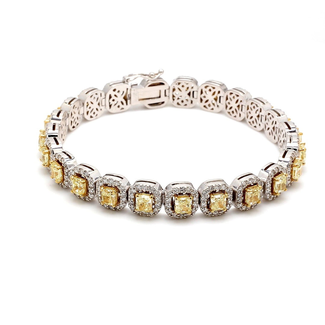 7"" Halo tennis bracelet in 18K WG with prong set rounds around (23) radiant cut diamond centers.  D11.11ct.t.w.