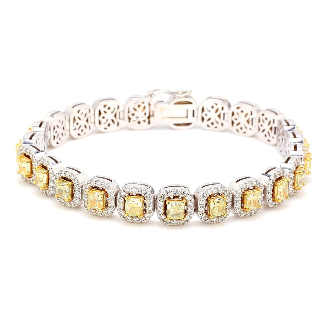7"" Halo tennis bracelet in 18K WG with prong set rounds around FY cushion cut diamond centers.  D10.43ct.t.w.