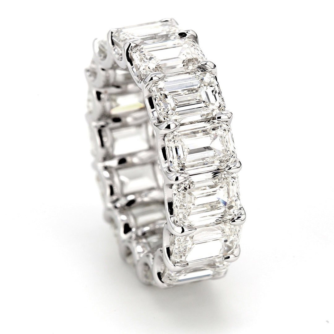 Eternity band in platinum with shared claw U-prong set (15) emerald cut diamonds.  D11.06ct.t.w.  Size 5.5