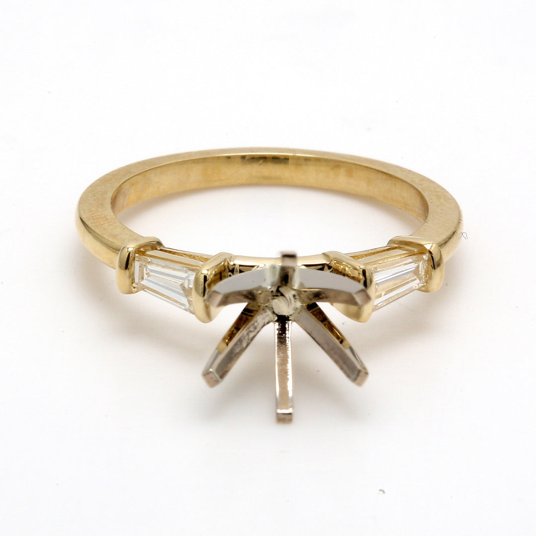 Three Stone semi-mount in 18K YG with tapered baguette diamond sides.  D0.33ct.t.w.  Size 6