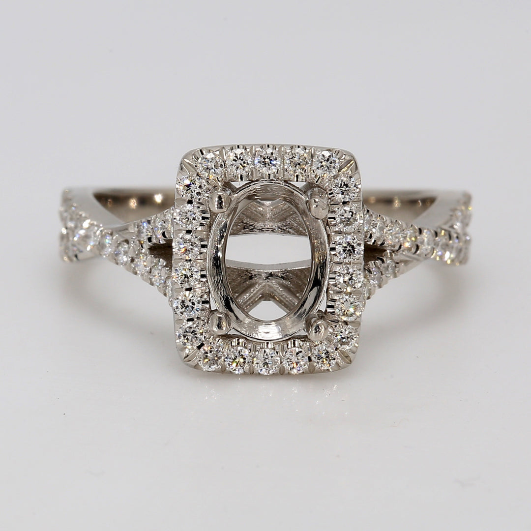 Halo semi-mount in platinum with pave set round diamonds.  D0.46ct.t.w.  Size 7