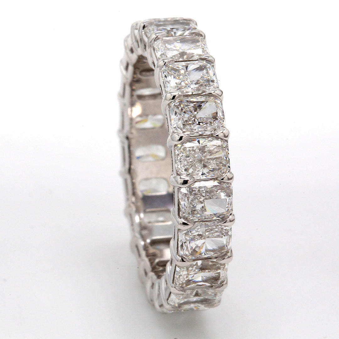 Eternity band in platinum with basket claw prong set F/VS1 (21) radiant cut diamonds.  D5.08ct.t.w .  Size 7