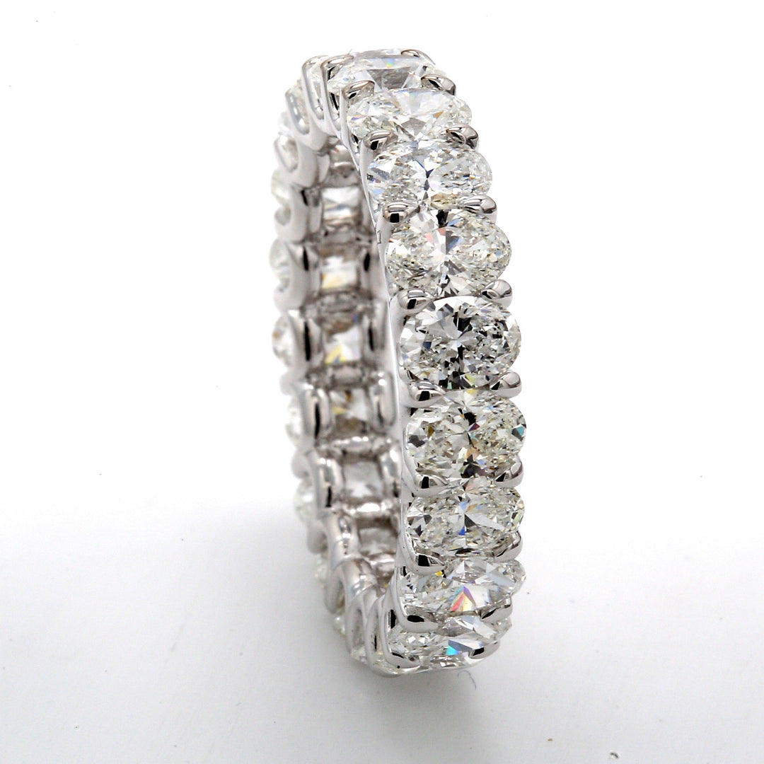 Eternity band in 18K WG with U-prong set oval diamonds.  D3.87ct.t.w.  Size 5