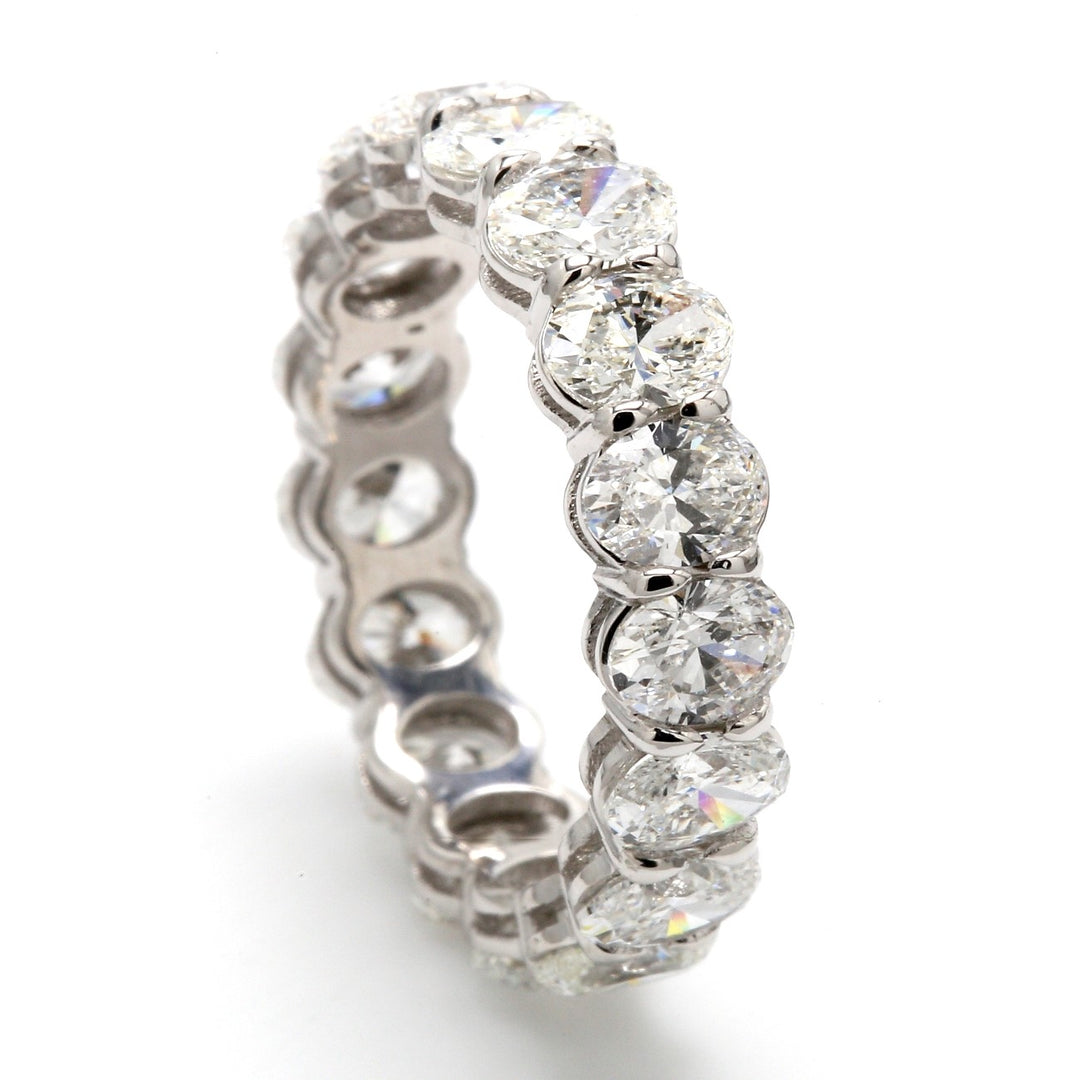 Eternity band in platinum with shared prong set (17) oval diamonds.  D3.37ct.t.w.