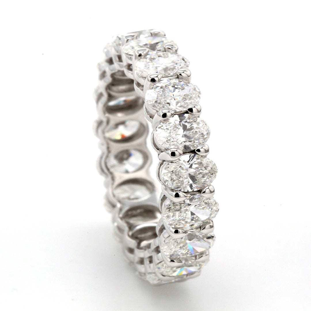 Eternity band in platinum with shared prong set oval diamonds.  D4.48ct.t.w.  Size 5.25