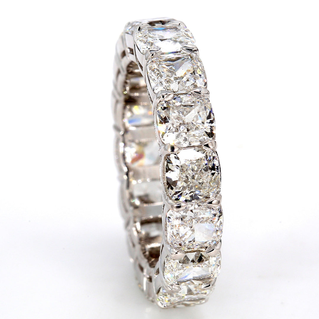 Eternity band in platinum with basket prong set F-G/SI1-SI2 (16) cushion cut diamonds.  D8.17ct.t.w.  Size 6.75