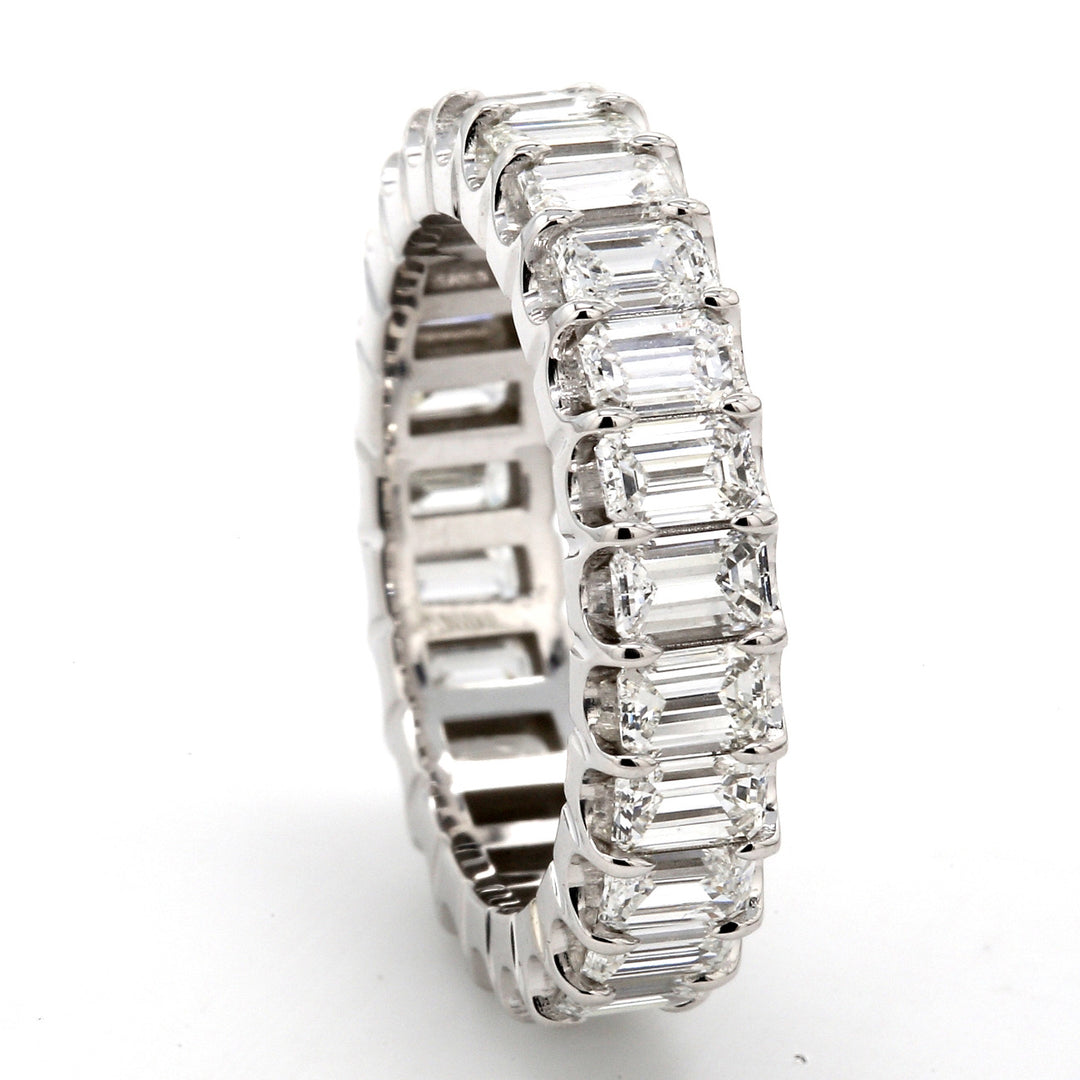 Eternity band in 18K WG with U-prong set (25) emerald cut diamonds.  D3.70ct.t.w.  Size 6.5