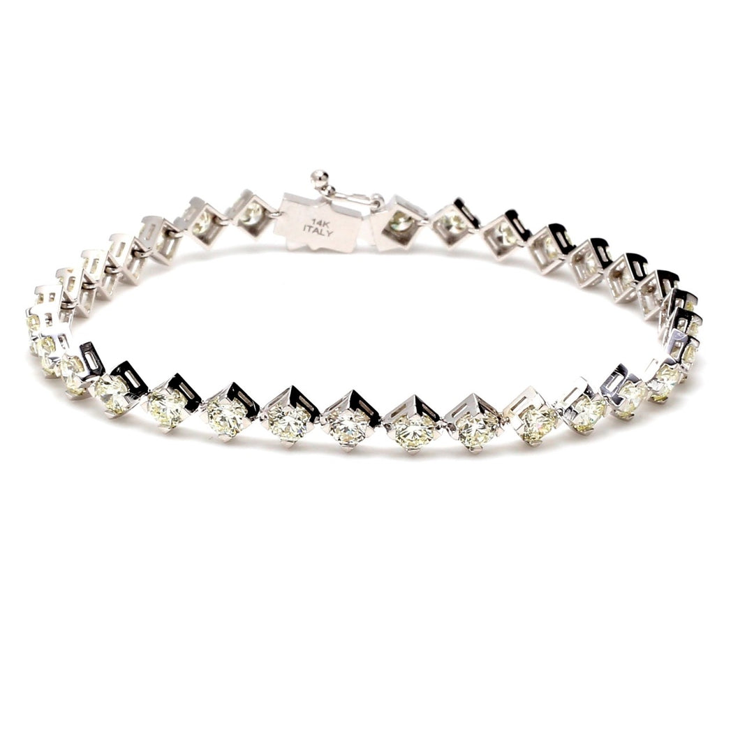 6.75"" Tennis bracelet with side ways prong set (32) round diamonds.  D5.99ct.t.w.