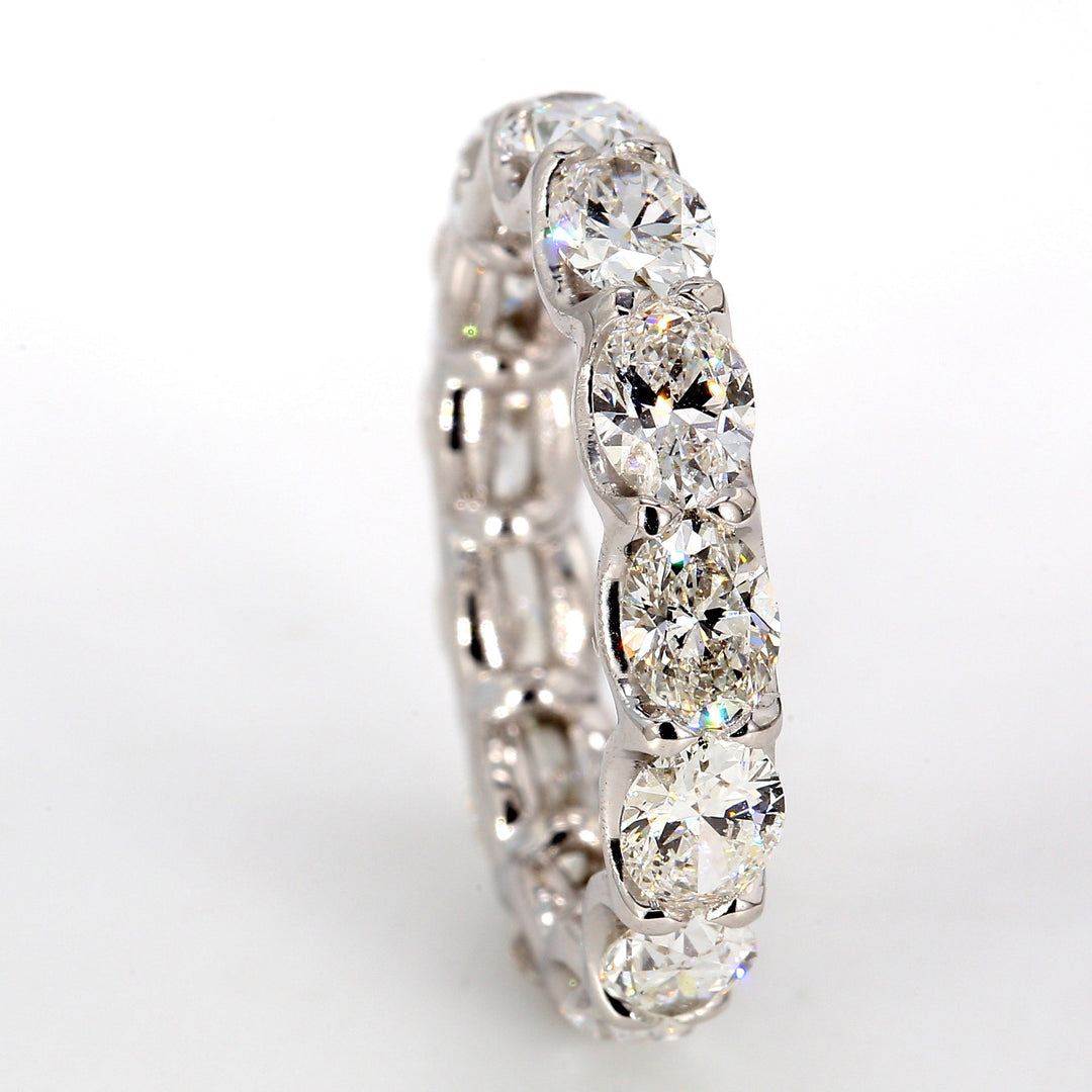 Eternity band east to west style in platinum with U-prong set (13) oval cut diamonds.  D3.94ct.t.w.  Size 6