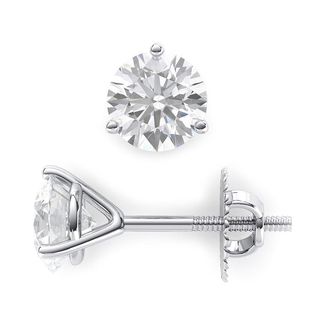 Screw back stud earrings with 3-prong set round diamonds.  D4.01ct.t.w.