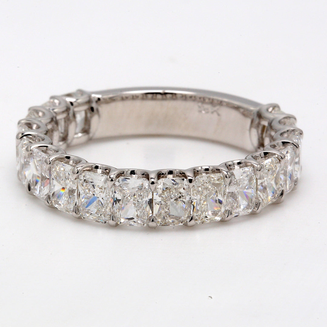 Band in 18K WG with U-prong set (17) radiant cut diamonds.  D4.31ct.t.w.  Size 8.75