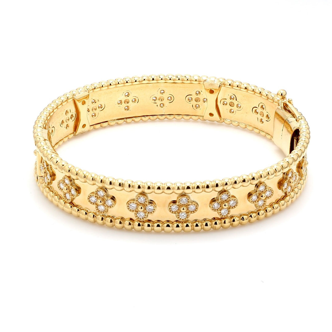Bangle in 18K YG with shared prong set (80) round diamonds.  D1.70ct.t.w.