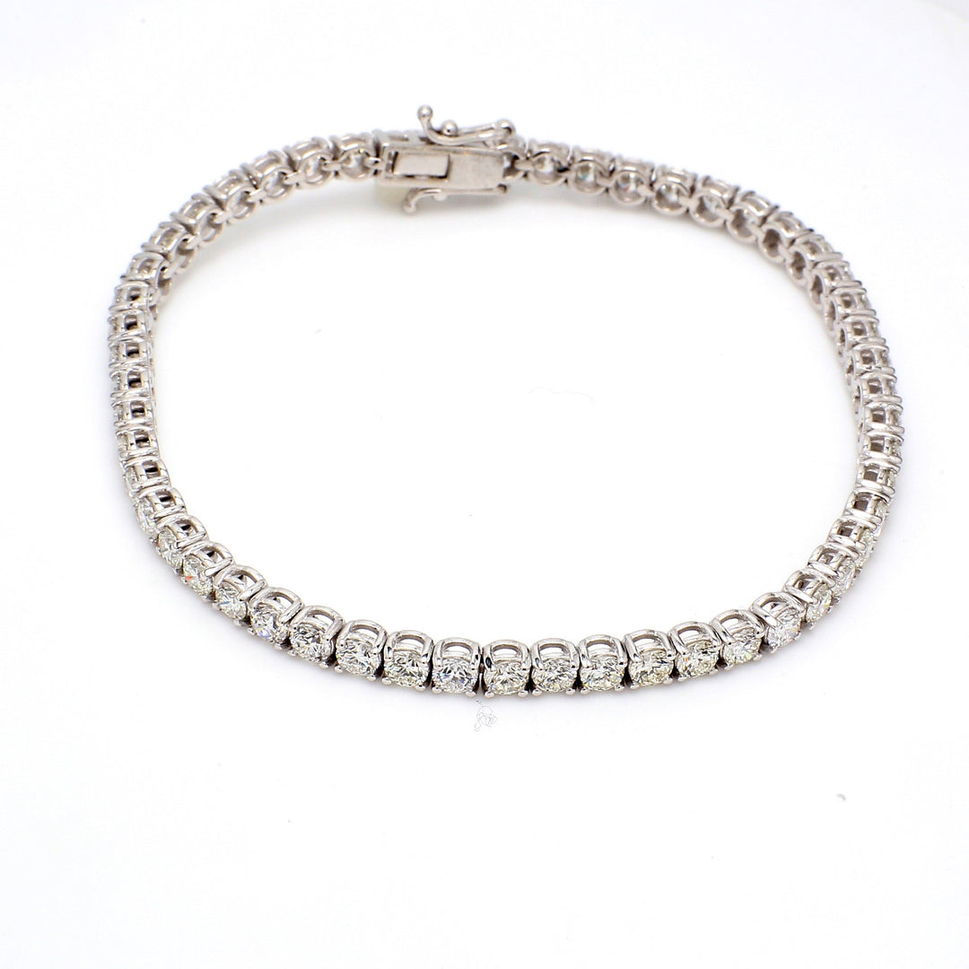 7.25"" Tennis bracelet with 4-prong set (53) round diamonds.  D6.54ct.t.w.