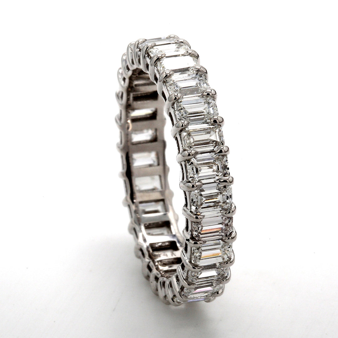 Eternity band with shared prong set (27) emerald cut diamonds.  D2.74ct.t.w.  Size 5