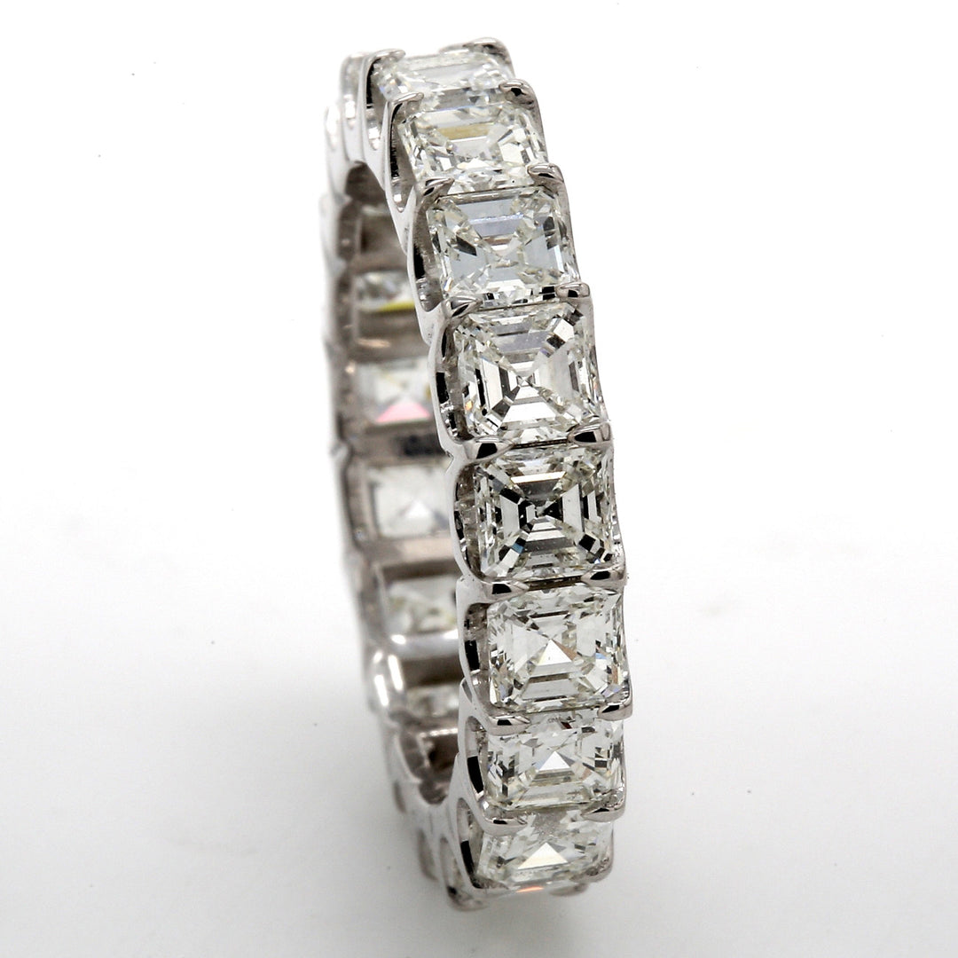 Eternity band in platinum with shared U-prong set (19) asscher cut diamonds.  D4.60ct.t.w.  Size 7