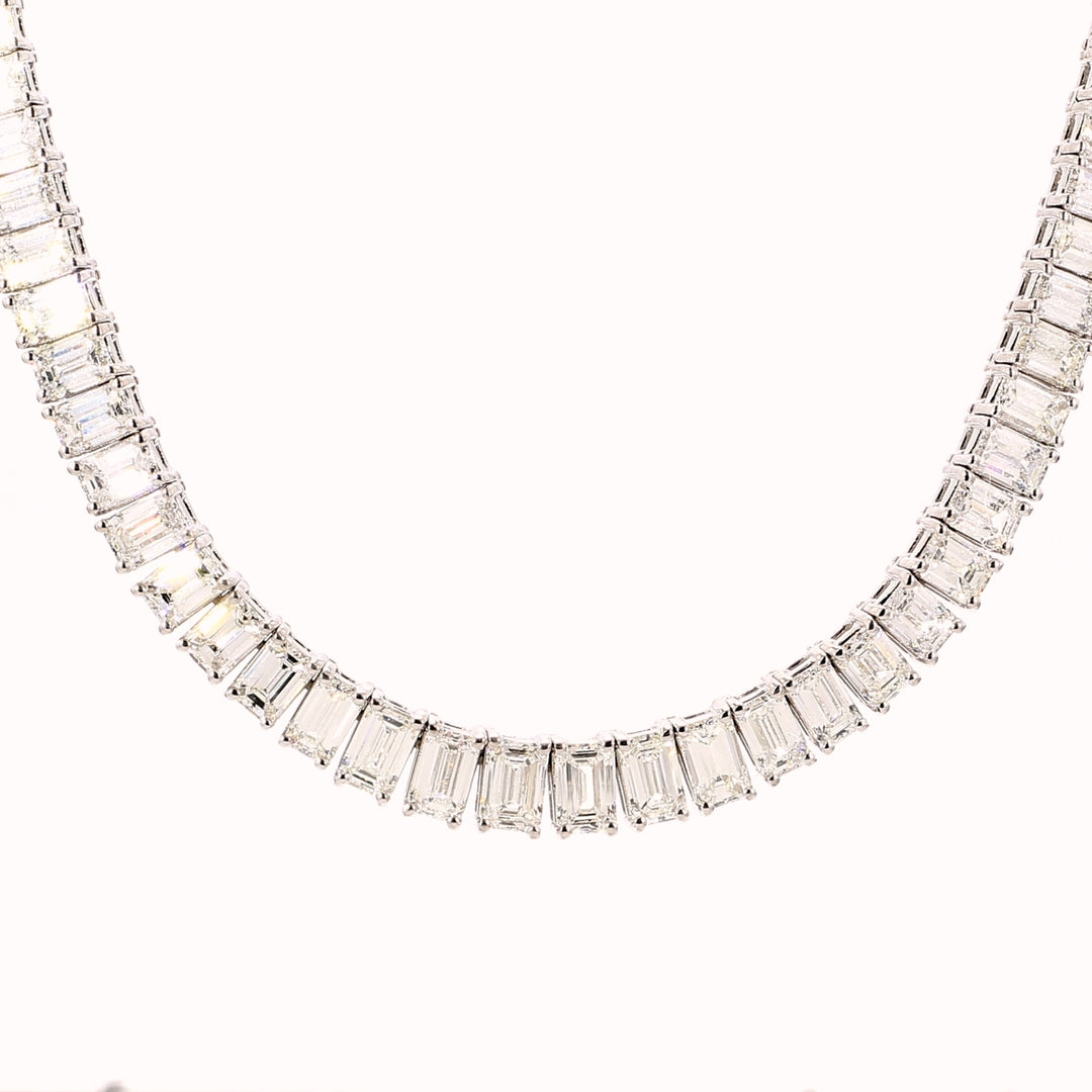 16"" Half-way graduated tennis necklace in 18K WG with prong set emerald cut diamonds.  D16.22ct.t.w.