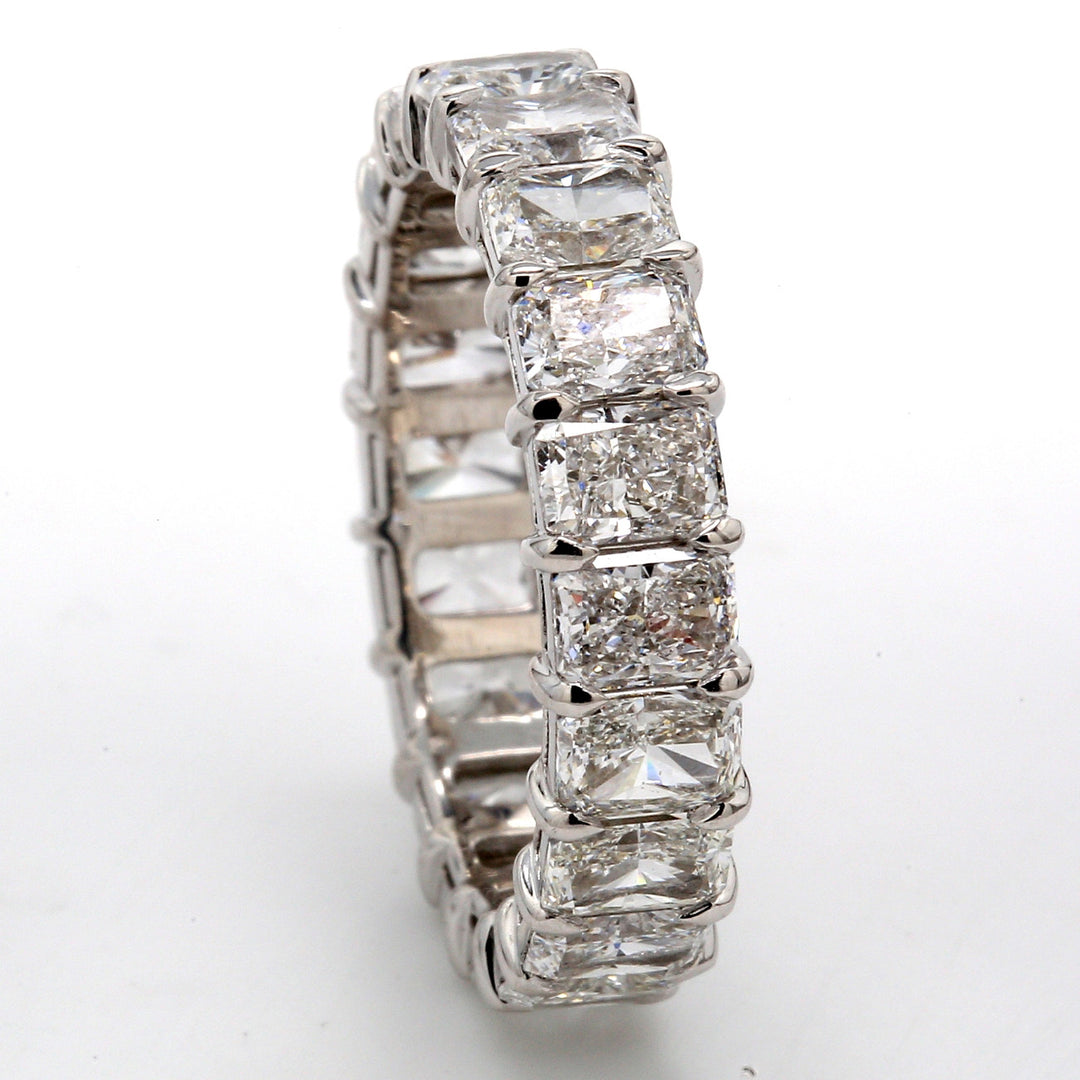 Eternity band in platinum with shared prong set (20) radiant cut diamonds.  D4.81ct.t.w.  Size 6