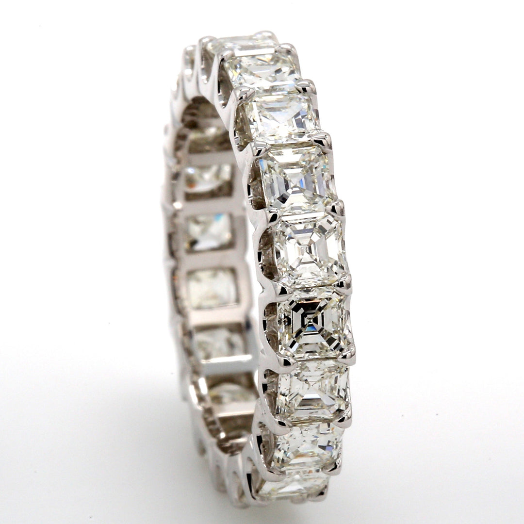 Eternity band in platinum with shared U-prong set (20) asscher cut diamonds.  D3.09ct.t.w.  Size 5