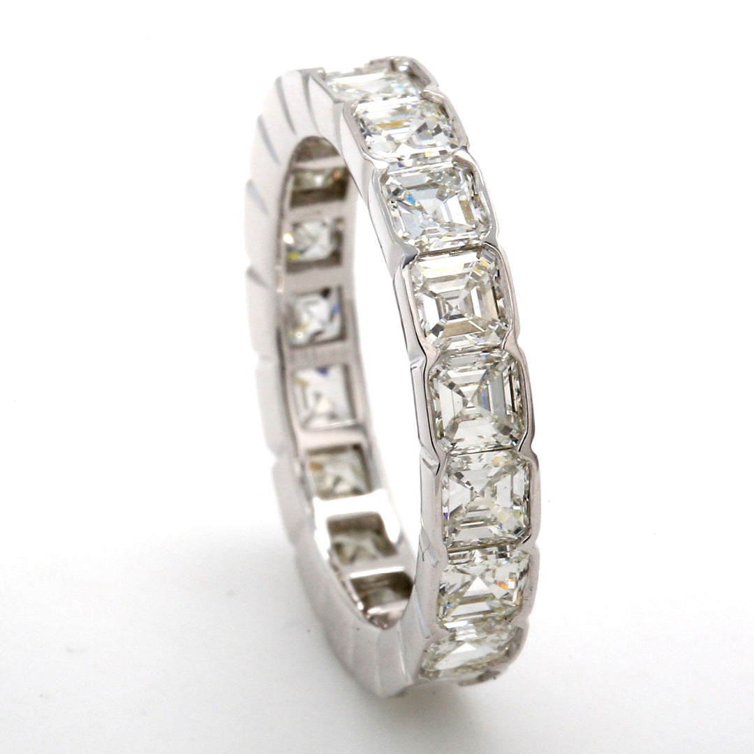Eternity band in platinum with half bezel set (19) asscher cut diamonds.  D2.86ct.t.w.  Size 4.75