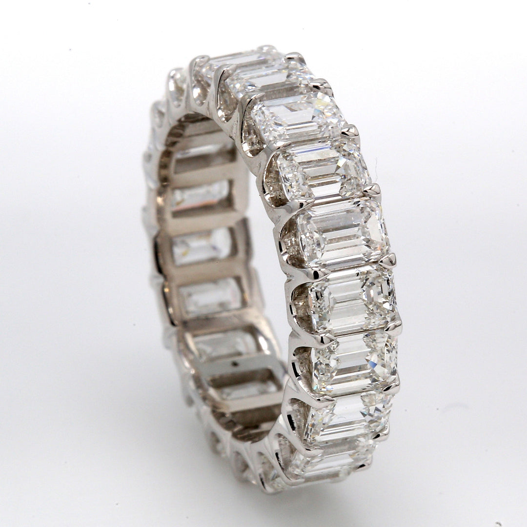 Eternity band in platinum with U-prong set (20) emerald cut diamonds.  D5.21ct.t.w.  Size 5