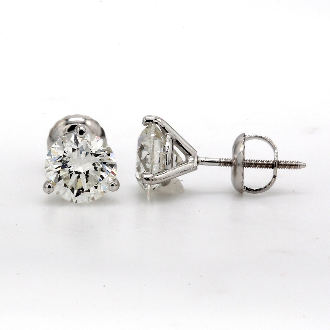 Screw back martini style stud earrings with 3-prong set I/SI1 round diamonds.  D6.02ct.t.w.