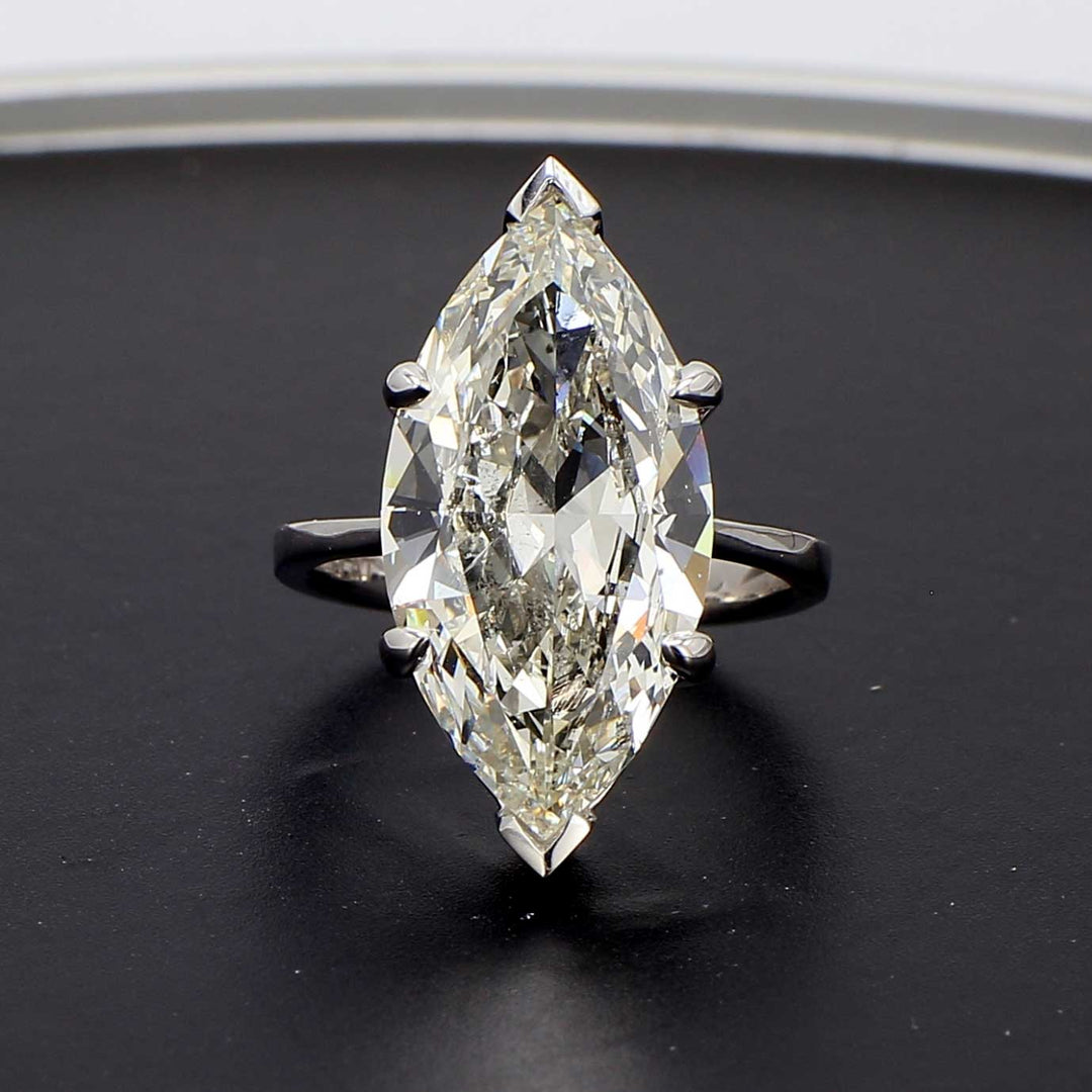Solitaire ring in platinum with 6-prong basket set GIA certified J/SI2 marquise diamond center.  D7.01ct.t.w.