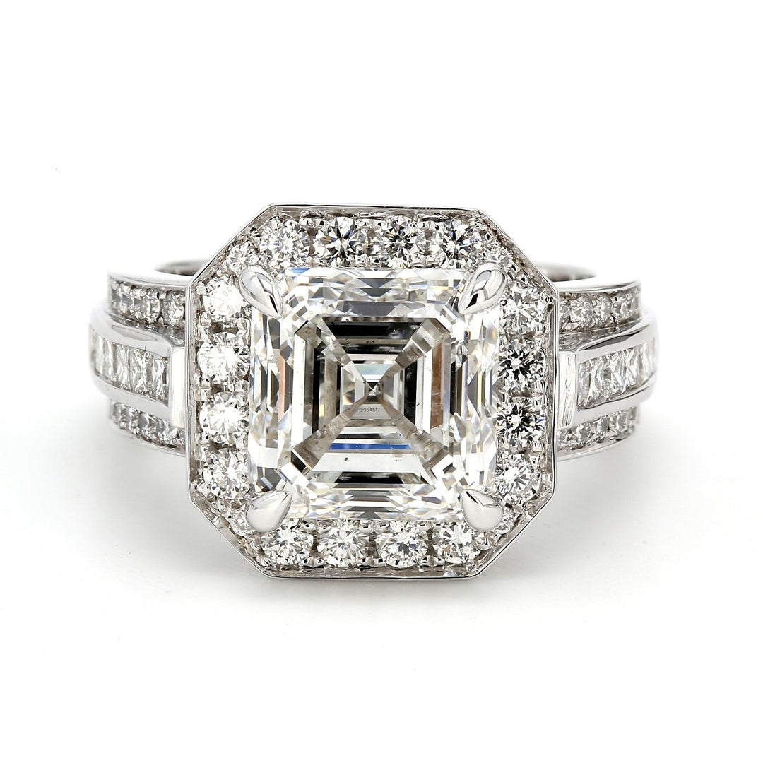Halo ring with claw prong set GIA certified H/SI2 asscher cut center, channel set princess cuts and pave set round diamonds.  D6.51ct.t.w.