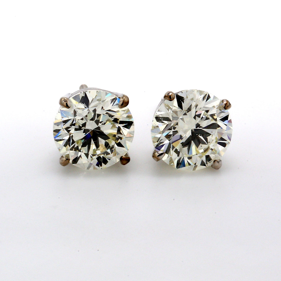 Screw back stud earrings with prong set USA certified J-K/SI2  round diamonds.  D4.02ct.t.w.