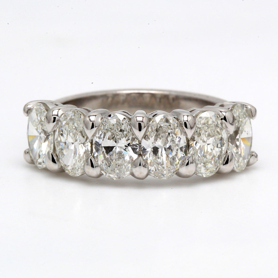 6-stone band with tapered shank and basket set oval diamonds.  D3.01ct.t.w.  Size 8