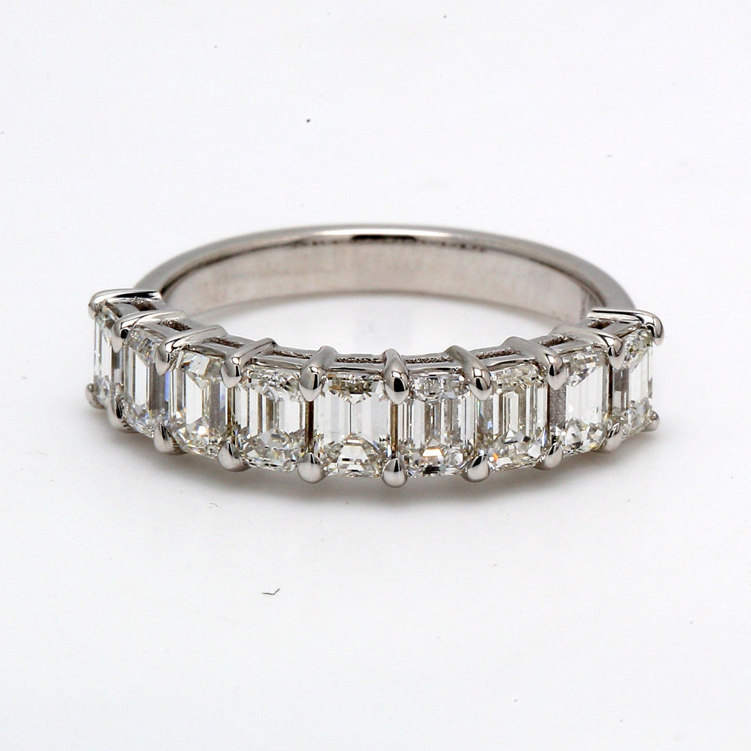 9-stone band in 18K WG with shared prong set emerald cut diamonds.  D1.60ct.t.w.  Size 5