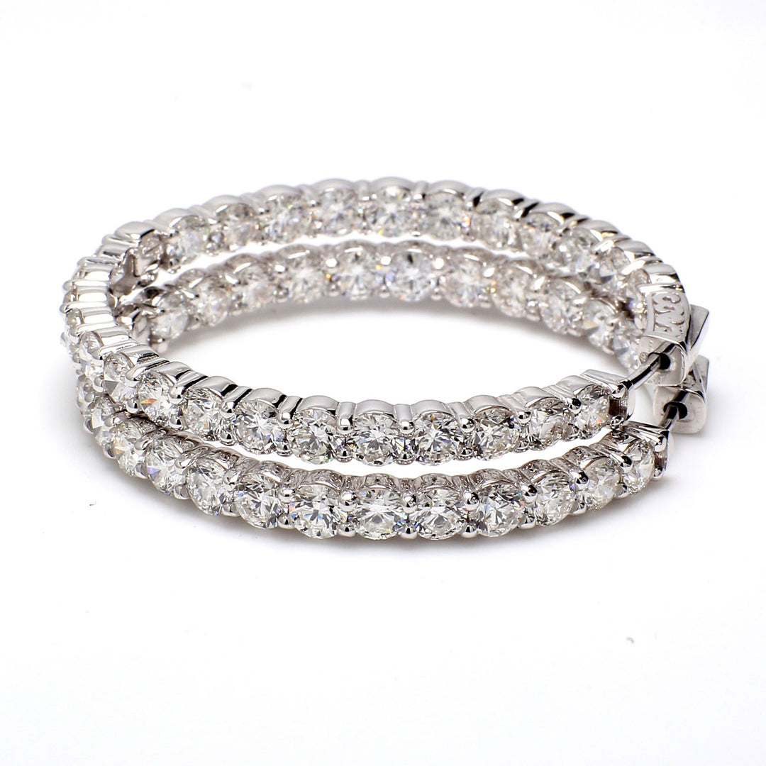 1.5"" Inside out hoop earrings with prong set (52) round diamonds.  D9.69ct.t.w.