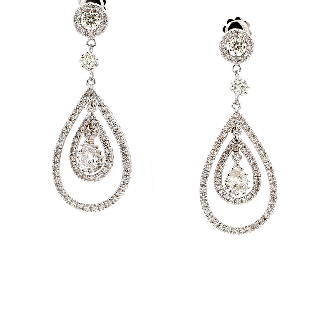Double halo dangling earrings with prong set pear centers and pave set 2-row round diamonds.  D4.02ct.t.w.