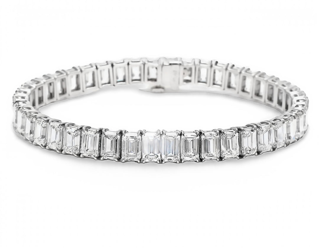 6.75"" Tennis bracelet in platinum with basket prong set GIA certified G-I/VVS1-VS (44) emerald cut diamonds.  D22.10ct.t.w.