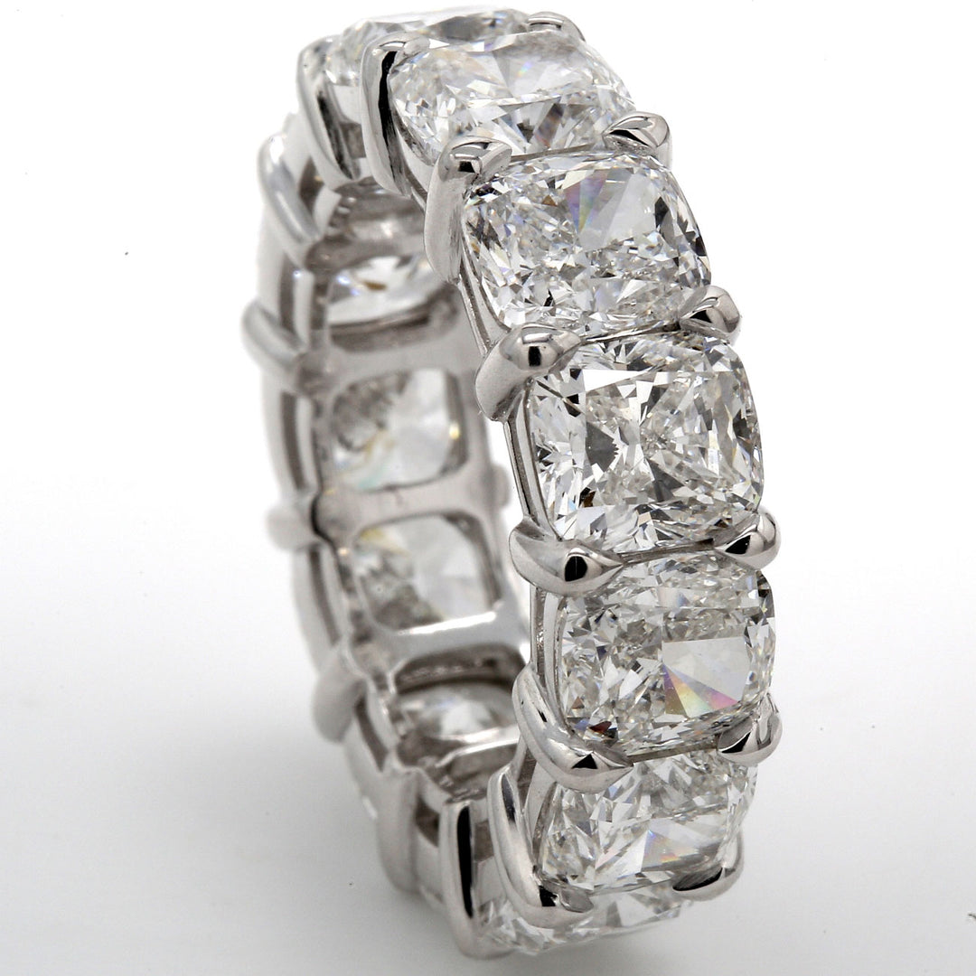 Eternity band in platinum with shared basket prong set GIA certified F-G/IF-VS2 cushion cut diamonds.  D16.21ct.t.w.  Size 7