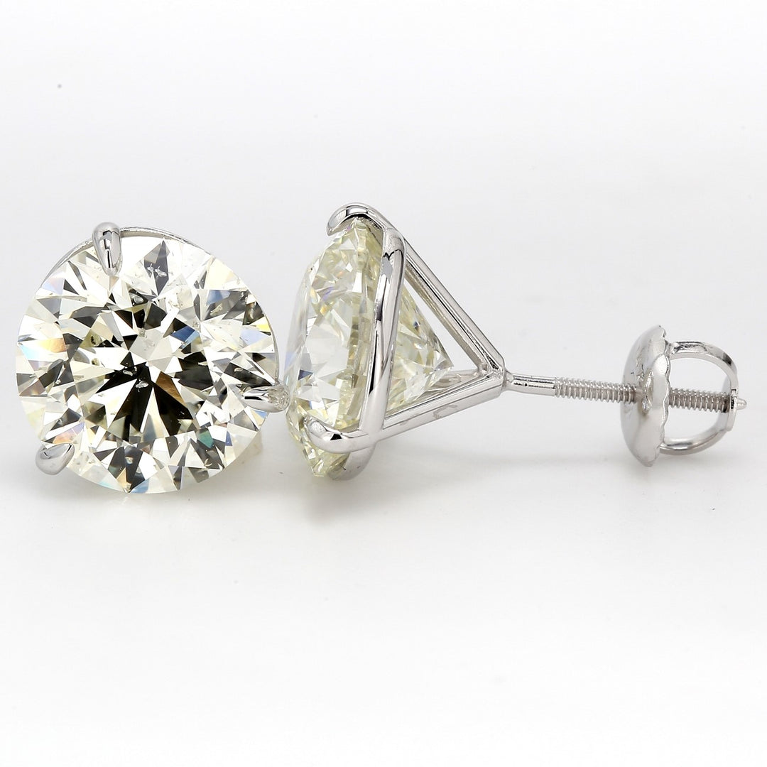 Screw back stud earrings with 3-prong set round diamonds.  D7.06ct.t.w.