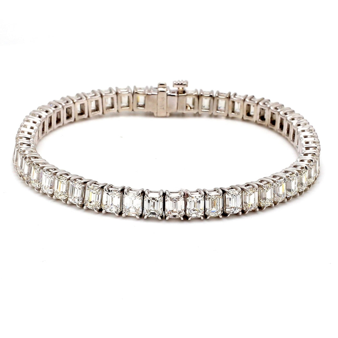 7"" Tennis bracelet in platinum with 4-prong set emerald cut diamonds.  D15.47ct.t.w.