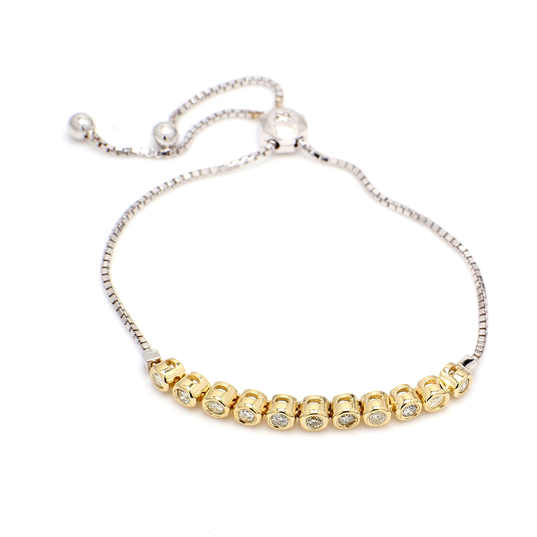 Bolo style bracelet with bezel set (13) round diamonds.  D0.67ct.t.w.