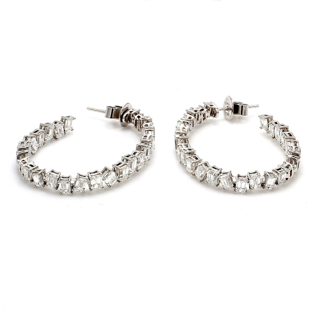 1.5"" Inside out hoop earrings in 18K WG with basket prong set (50) emerald cut diamonds.  D7.35ct.t.w.
