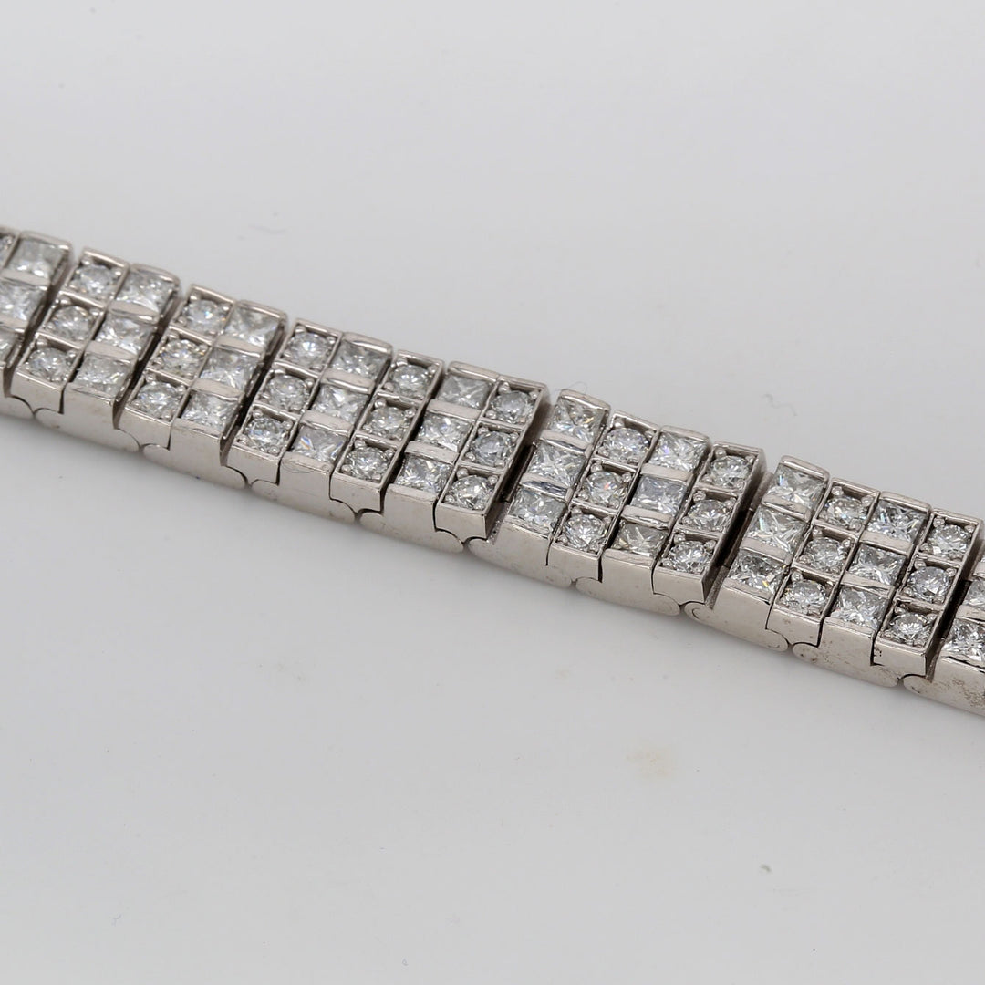7"" 3-row tennis bracelet with prong set round and princess cut diamonds.  D8.14ct.t.w.