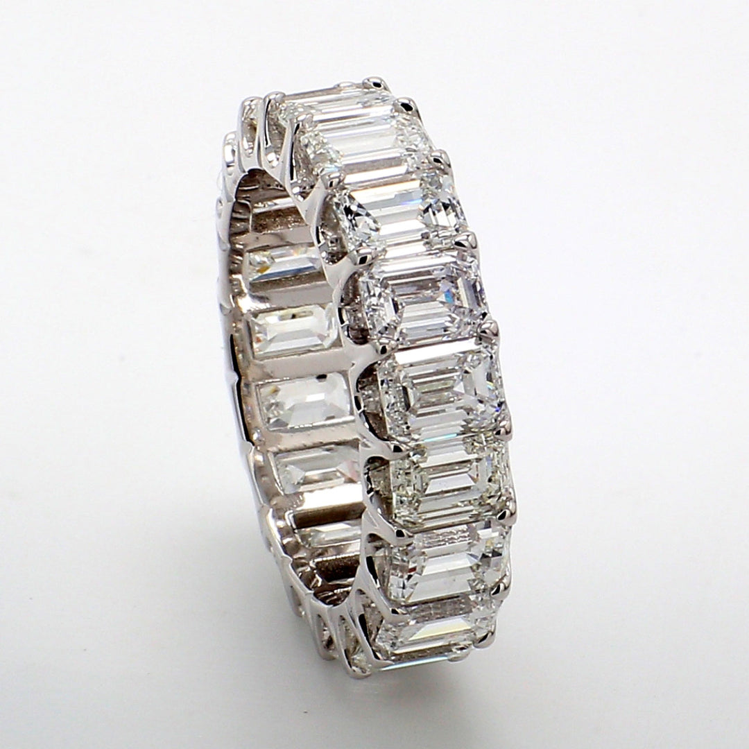 Eternity band in platinum with U-prong set (19) emerald cut diamonds.  D6.17ct.t.w.  Size 5.5