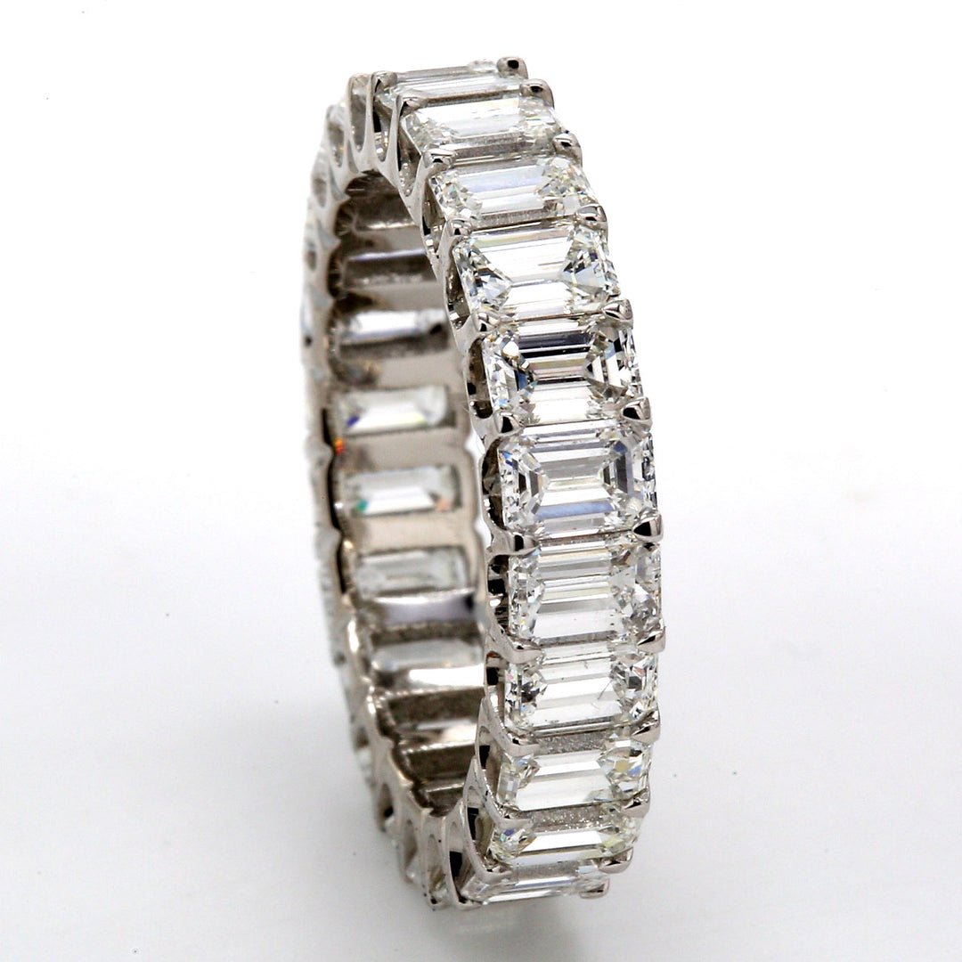 Eternity band in platinum with U-prong set (24) emerald cut diamonds.  D4.60ct.t.w.  Size 6