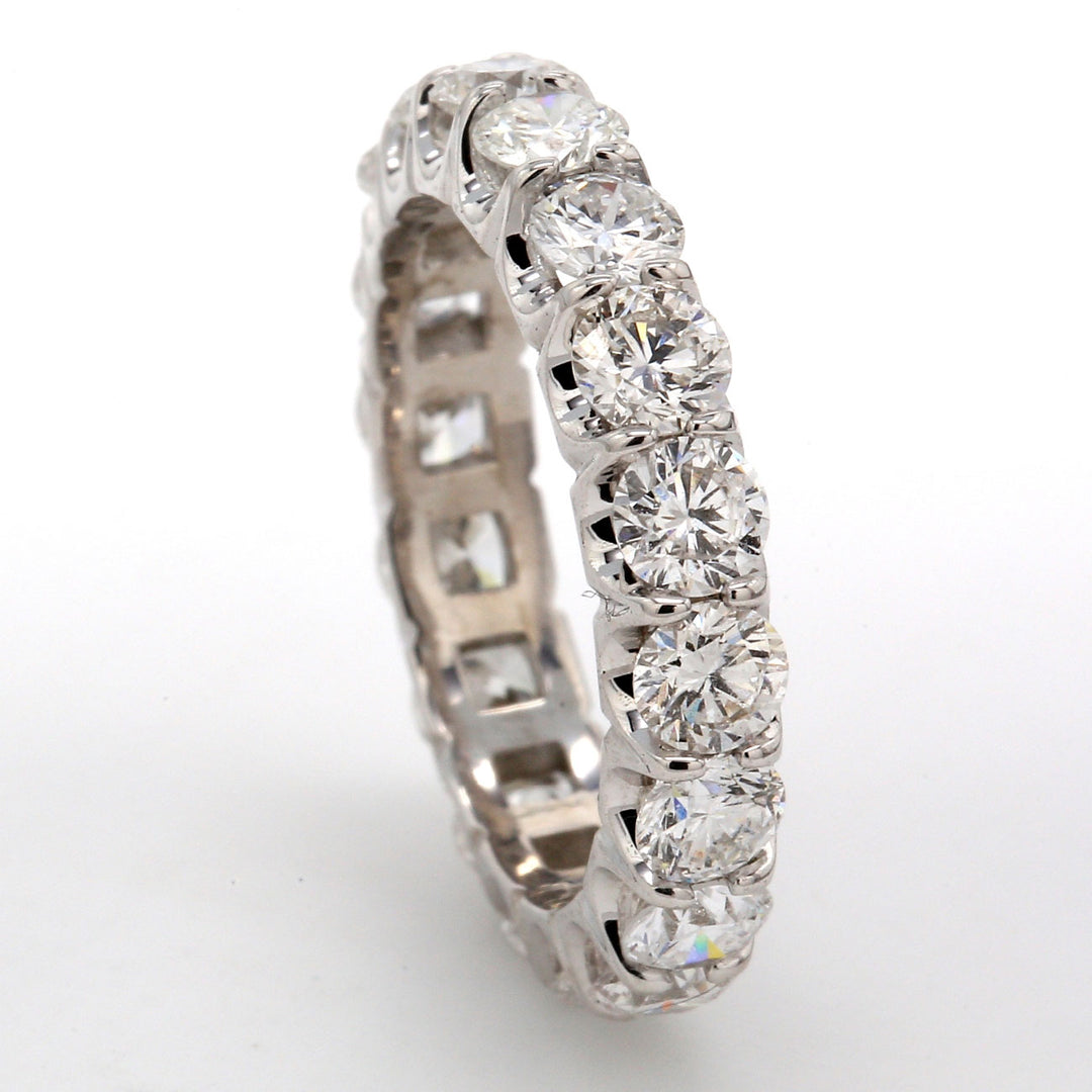 Eternity band in platinum with U-prong set (18) round diamonds.  D3.15ct.t.w.  Size 6
