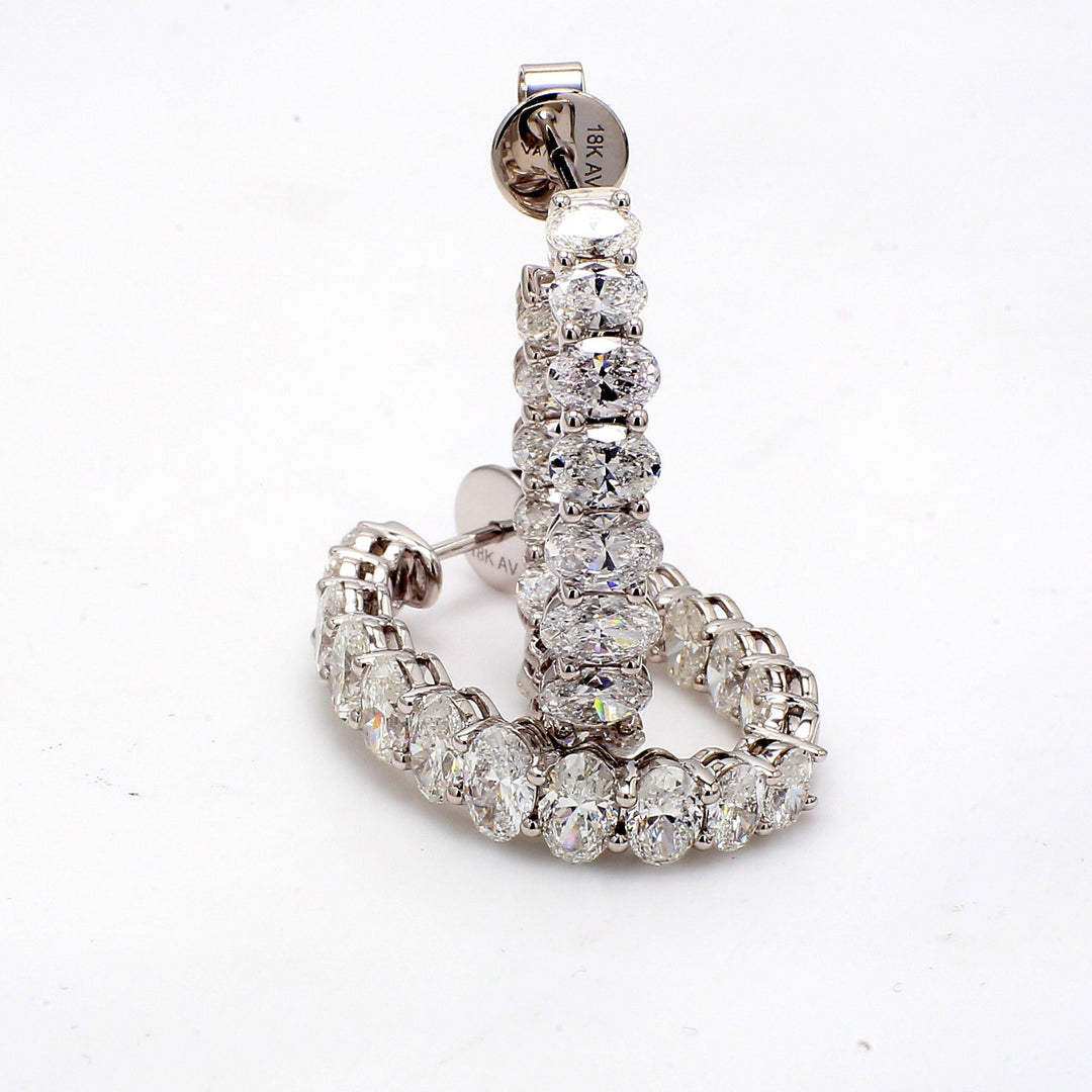 0.75"" Inside out hoop earrings in 18K WG with basket prong set (32) oval diamonds.  D5.85ct.t.w.