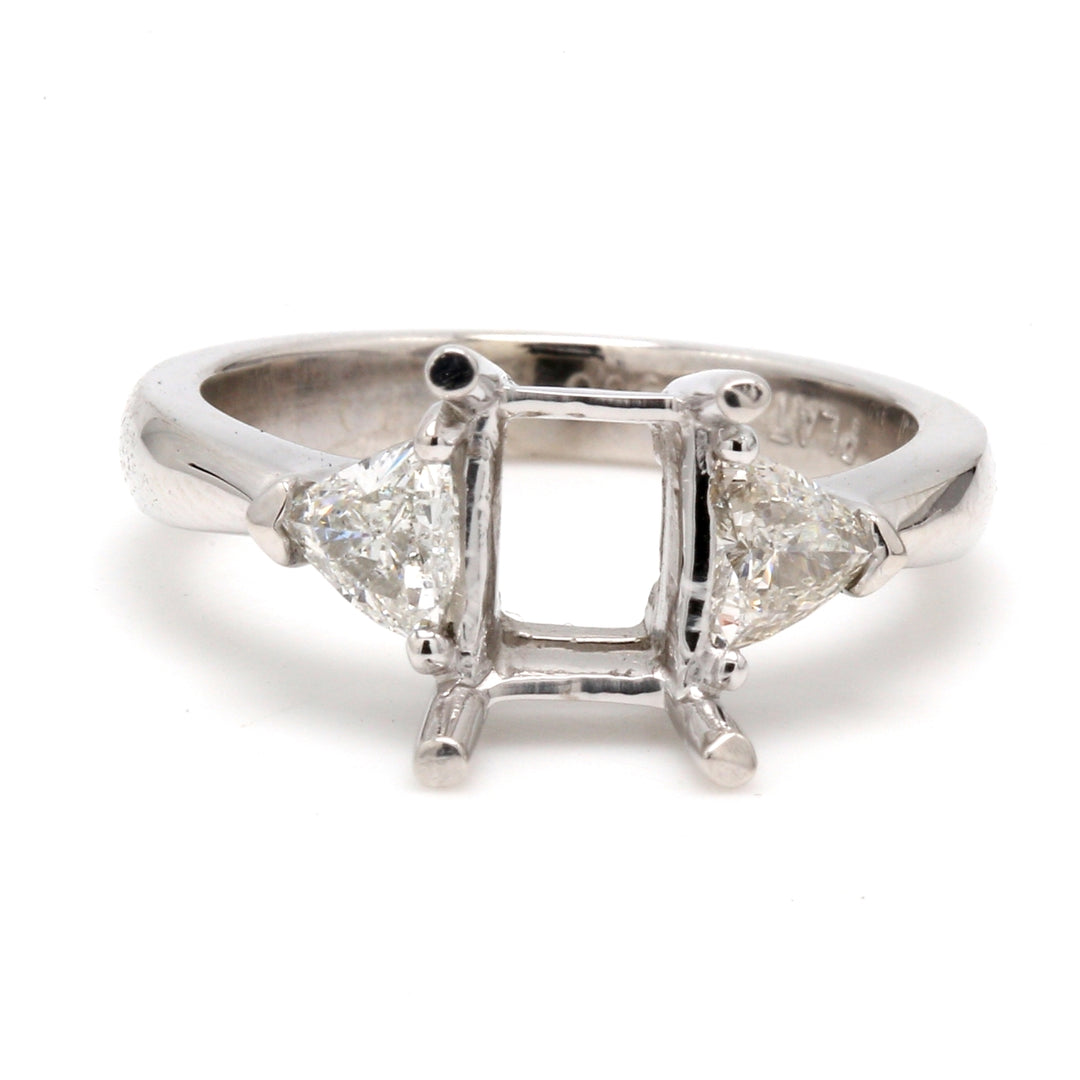 3-stone ring in platinum with claw prong set GIA certified J/SI2 emerald cut center and emerald cut diamond sides.  D3.61ct.t.w.  (Center 3.01ct.)