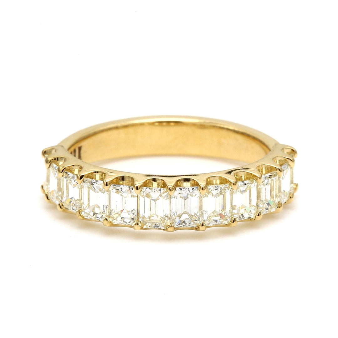 Band in 18K YG with U-prong set (12) emerald cut diamonds.  D1.37ct.t.w.  Size 6