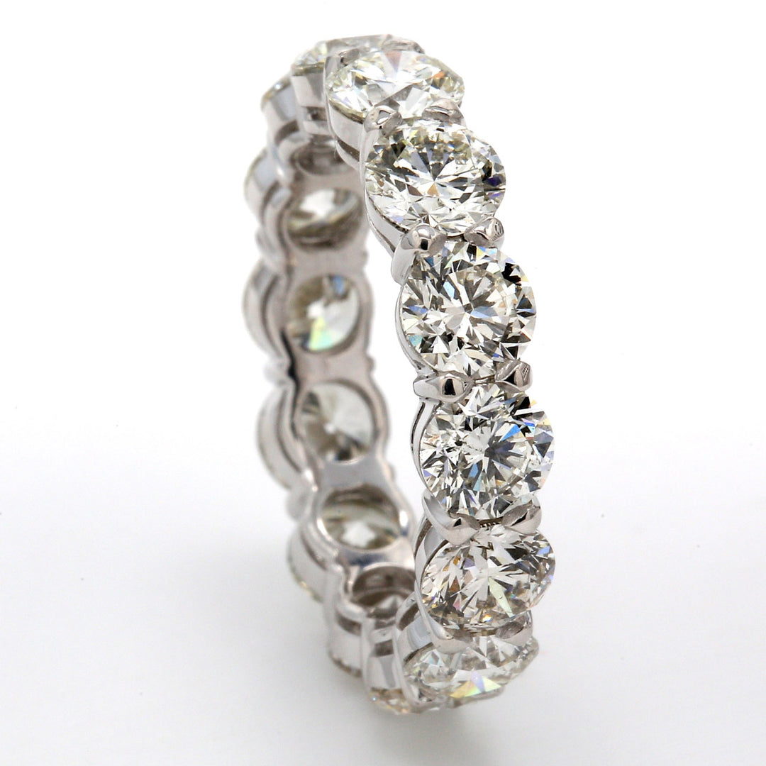 Eternity band in platinum with basket claw set (14) round diamonds.  D5.61ct.t.w.  Size 6.5