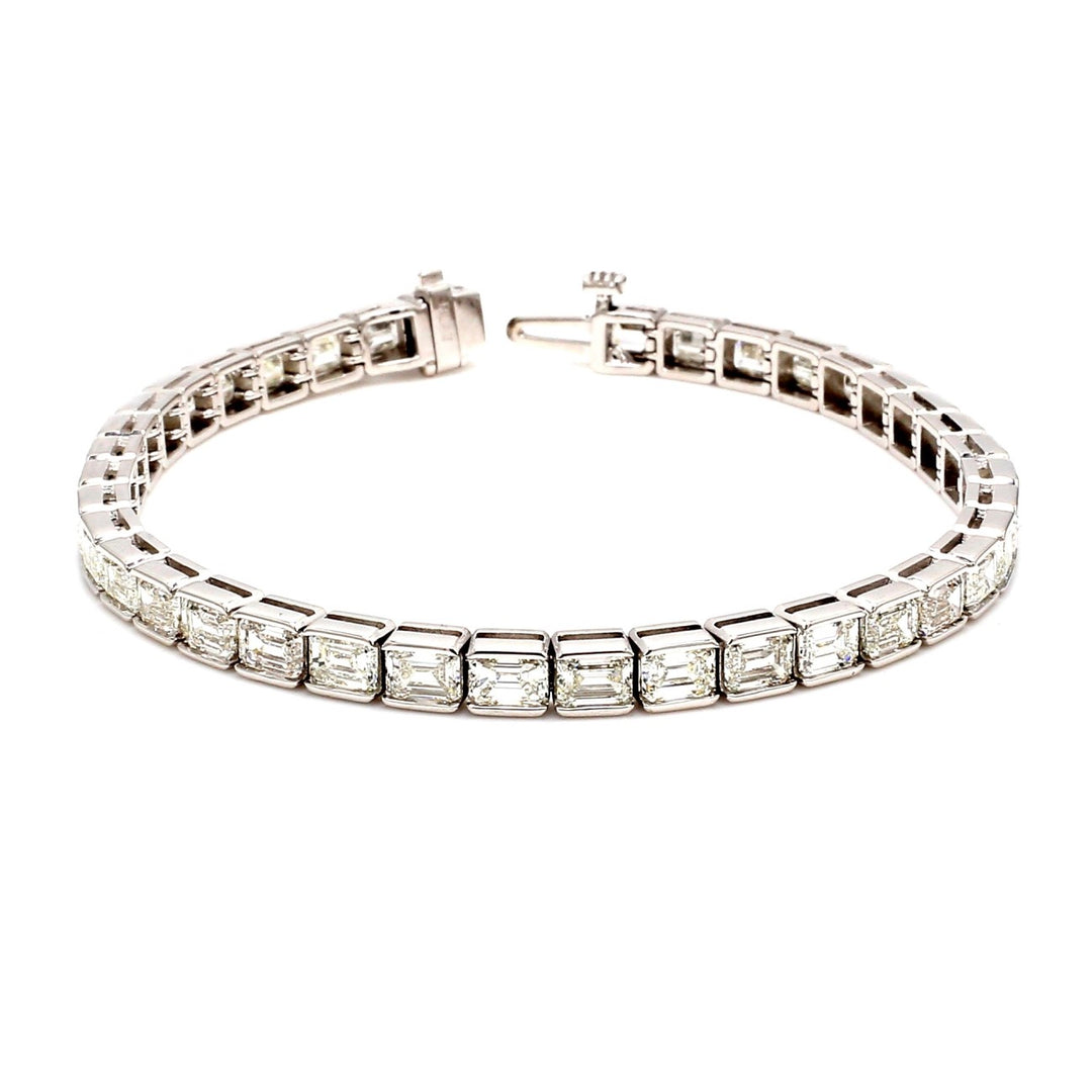 7"" Tennis bracelet in platinum with half bezel set (38) emerald cut diamonds.  D11.58ct.t.w.