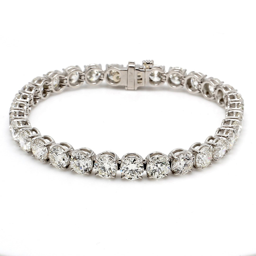7"" Tennis bracelet in platinum with basket prong set GIA certified H-J/SI1-SI2 (31) round diamonds.  D21.75ct.t.w.